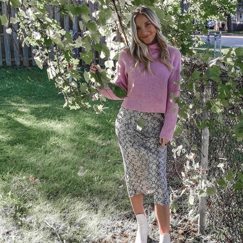 pink turtleneck sweater